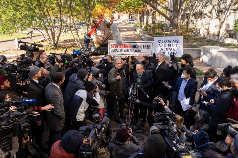 Former Trump Administration White House advisor Steve Bannon and attorney David Schoen speak to the press as they leave federal court on November 15, 2021 in Washington, DC.