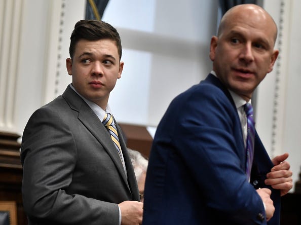 Kyle Rittenhouse, left, and his attorney Corey Chirafisi.