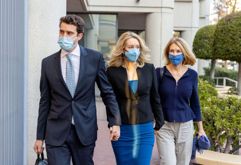 Theranos founder and former CEO Elizabeth Holmes along with her mother Noel Holmes (R) and partner Billy Evans arrive for her trial at the Robert F. Peckham Federal Building November 22, 2021 in San Jose, California.
