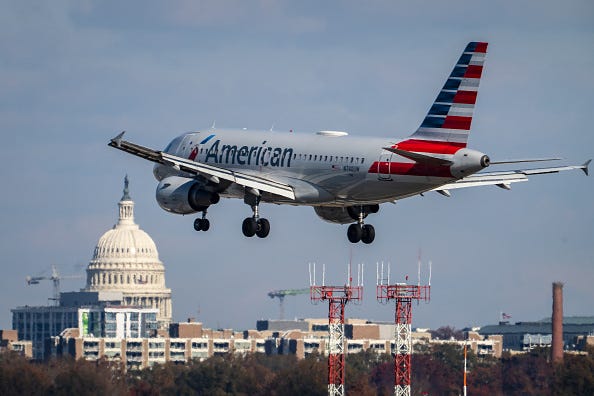 An American Airlines plane lands at Ronald Reagan Washington National Airport November 23, 2021 in Arlington, Virginia.