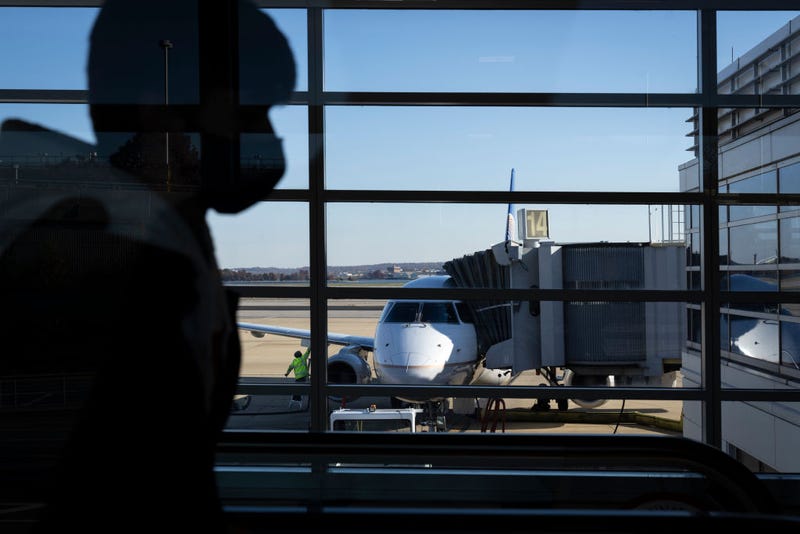 Travelers walk through Terminal A at Ronald Reagan Washington National Airport November 23, 2021 in Arlington, Virginia.