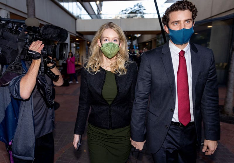 Theranos founder and former CEO Elizabeth Holmes along with her partner Billy Evans (R) leave the Robert F. Peckham Federal Building on November 23, 2021 in San Jose, California. 