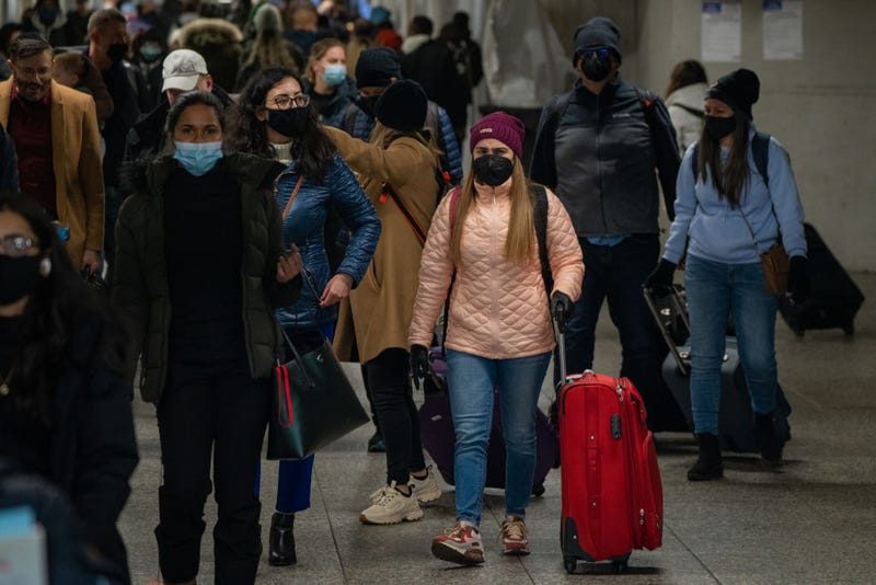 Travelers make their way through Penn Station on November 24, 2021 in New York City