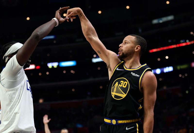 Stephen Curry #30 of the Golden State Warriors celebrates scoring a three-point basket against the Los Angeles Clippers during the second half of the game at Staples Center on November 28, 2021 in Los Angeles, California.