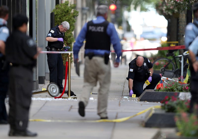 Chicago police investigate the shooting of rapper FBG Duck in the first block of East Oak Street in the Gold Coast neighborhood on Aug. 4, 2020.