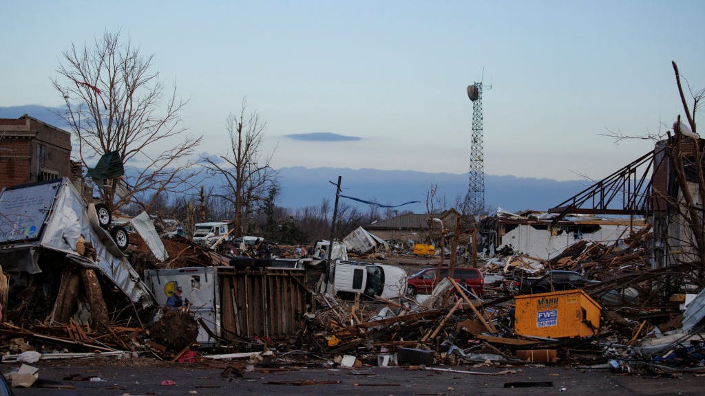 Train derailed by tornadoes damages homes