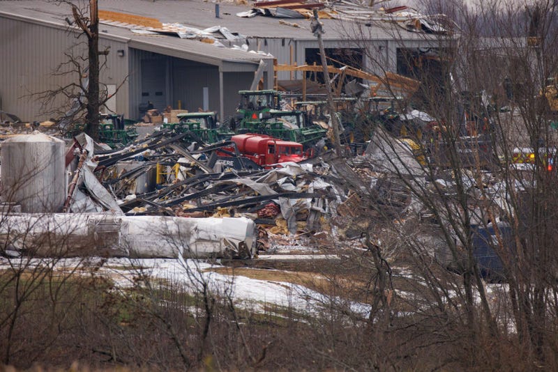 General view of the collapsed Mayfield Consumer Products building (foreground) where workers were present when the tornado came through Friday night on December 11, 2021 in Mayfield, Kentucky. Multiple tornadoes tore through parts of the lower Midwest late on Friday night leaving a large path of destruction. (Photo by Brett Carlsen/Getty Images)