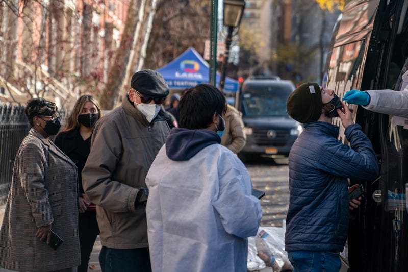 A person has a COVID-19 test administered at a walk up testing site on December 15, 2021 in New York City