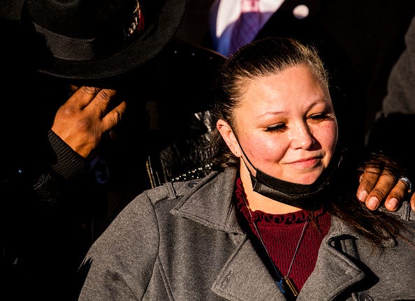 Aubrey Wright (L) and Katie Wright (R), parents of Daunte Wright, join friends and family outside the Hennepin County Courthouse after the verdict was read in the trial of Kim Potter on December 23, 2021 in Minneapolis, Minnesota