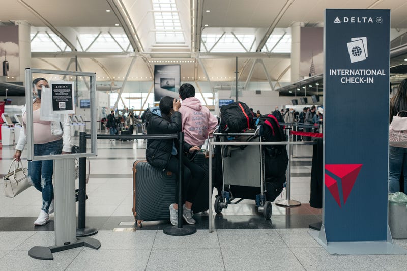 Travelers move through the departures hall at Terminal 4 of John F. Kennedy International Airport on December 24, 2021 in New York City.