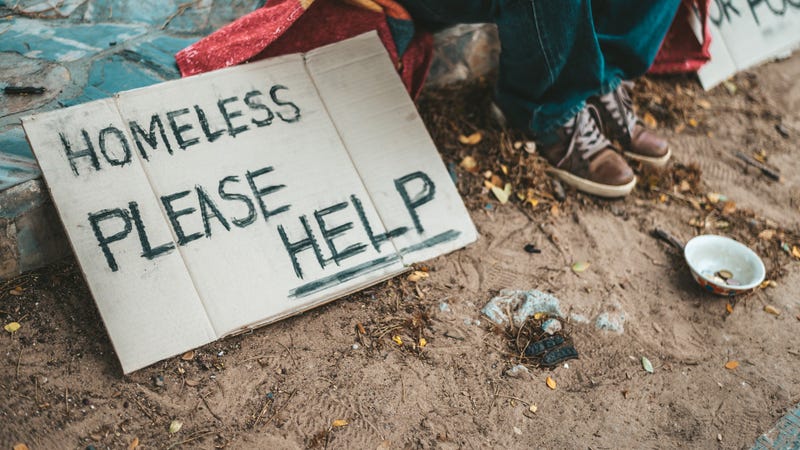 homeless please help message. Selective focus