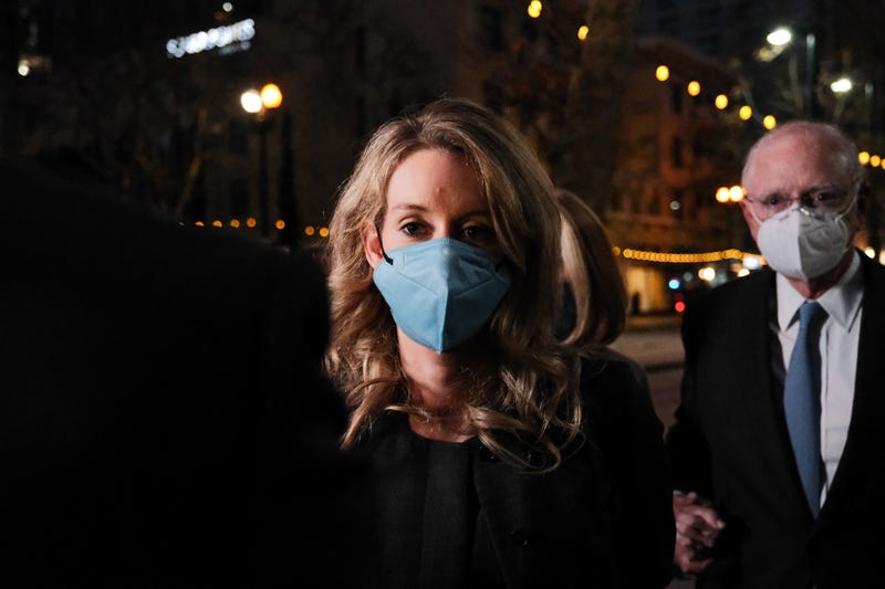 SAN JOSE, CA - JANUARY 3: Theranos founder and former CEO Elizabeth Holmes and her lawyer leave the Robert F. Peckham Federal Building on January 3, 2022 in San Jose, California. A jury found Elizabeth Holmes guilty on three counts of wire fraud and one count of conspiracy to defraud investors.