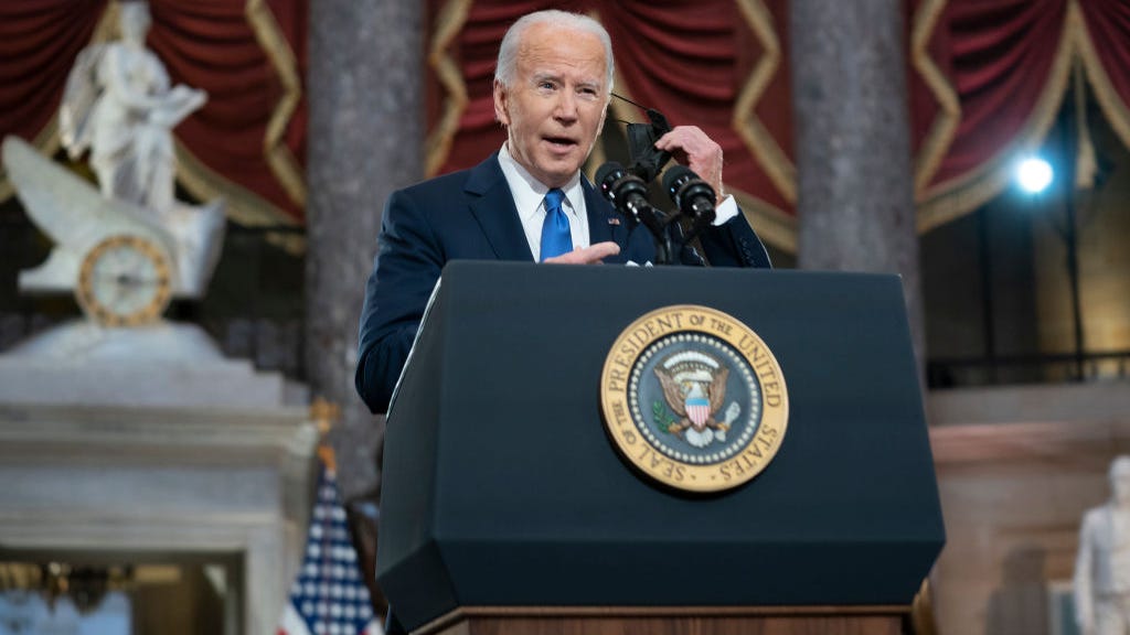 Biden targets Trump as he marks one year since deadly Capitol attack