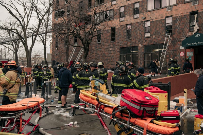 Emergency first responders remain at the scene of an intense fire at a 19-story residential building that erupted in the morning on Jan. 9, 2022 in the Bronx
