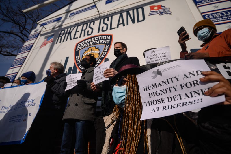 Demonstrators attend a rally in solidarity with hunger-striking inmates at the entrance to the Rikers Island prison complex in Queens, New York, January 13, 2022.