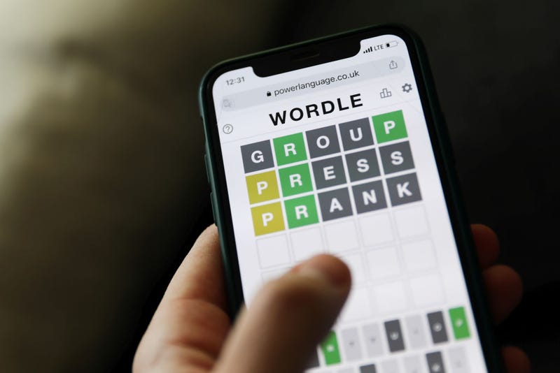 Person plays the popular Wordle game on their cellphone. 