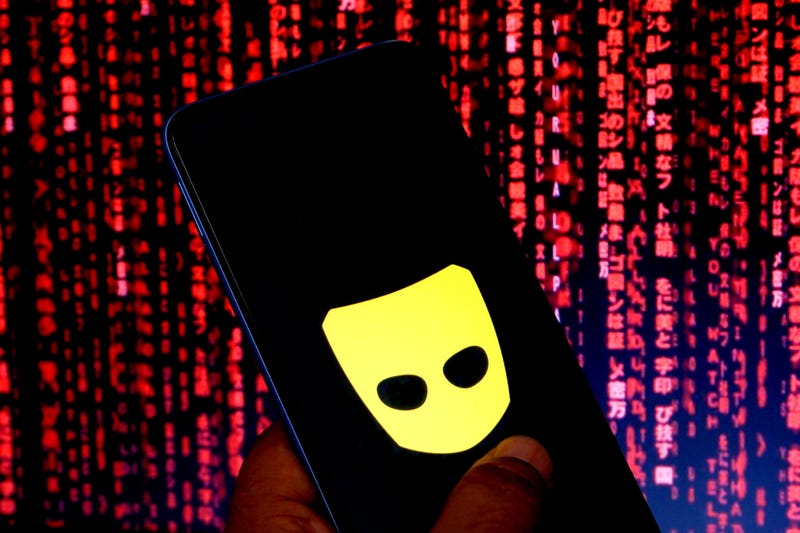 In this photo illustration a Grindr logo seen displayed on a smartphone. 