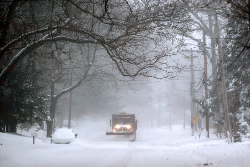 A plow drives down Lower Sheep Pasture road shoveling snow during a major snowstorm on January 29, 2022 in Stony Brook, New York.