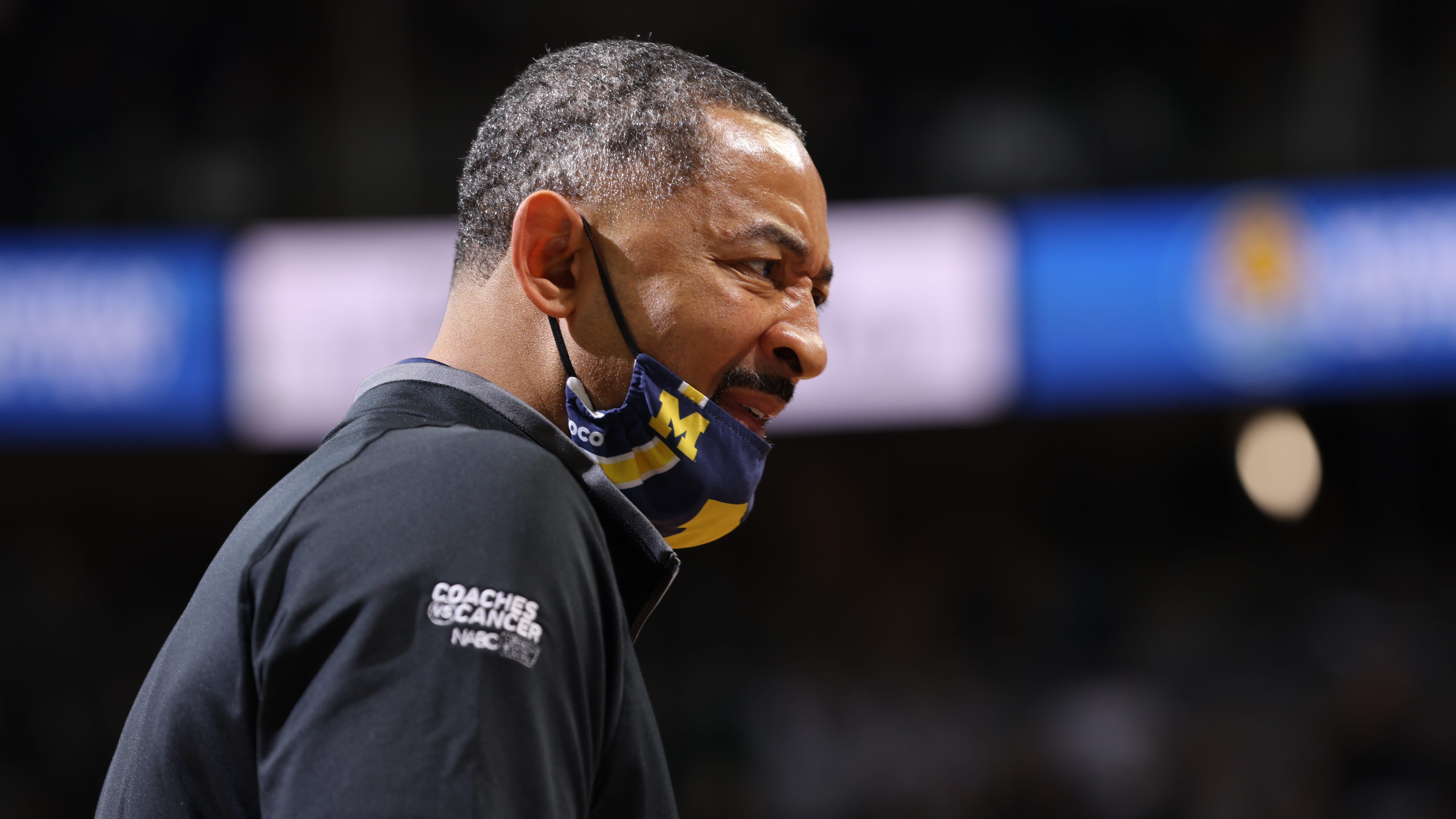WATCH: Juwan Howard throws hands as brawl erupts after Michigan-Wisconsin game