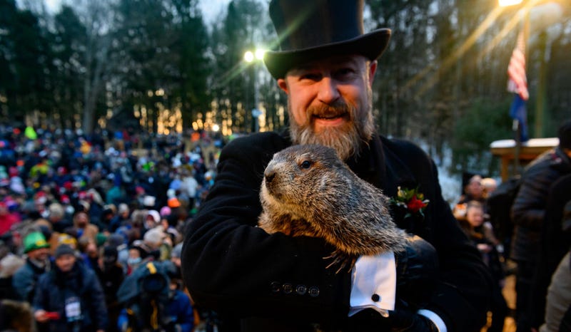 Groundhog handler AJ Derume holds Punxsutawney Phil, who saw his shadow, predicting a late spring during the 136th annual Groundhog Day festivities on February 2, 2022