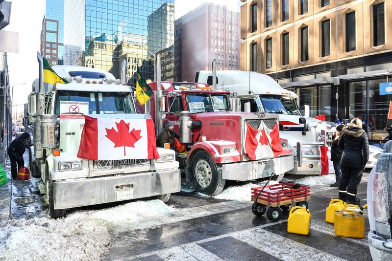 Truckers refuel their trucks in the cold during the Freedom Convoy truck protest on Feb. 5, 2022 in Ottawa, Canada. Truckers continue their rally over the weekend near Parliament Hill in hopes of pressuring the government to roll back COVID-19 public health regulations and mandates. 