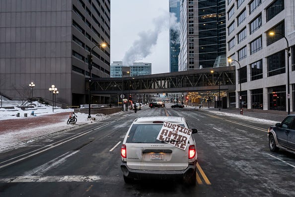 A van with a sign calling for justice for Amir Locke drives through downtown on February 5, 2022 in Minneapolis, Minnesota. 