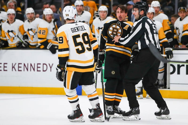 Brad Marchand #63 of the Boston Bruins is pulled away from Teddy Blueger #53 of the Pittsburgh Penguins in the third period of a game at TD Garden