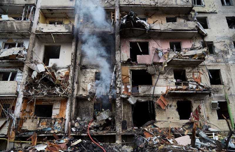 Firemen extinguish a fire inside a residential building that was hit by a missile on February 25, 2022 in Kyiv, Ukraine. Yesterday, Russia began a large-scale attack on Ukraine, with Russian troops invading the country from the north, east and south, accompanied by air strikes and shelling. The Ukrainian president said that at least 137 Ukrainian soldiers were killed by the end of the first day. (Photo by Pierre Crom/Getty Images)