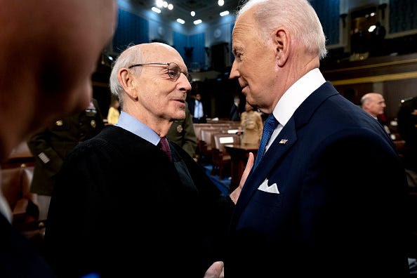 U.S. President Joe Biden speaks with Supreme Court Justice Stephen Breyer after delivering the State of the Union in the U.S. Capitol House Chamber on March 1, 2022 in Washington, DC.