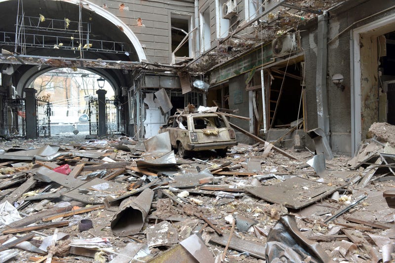 A picture shows damages in a building entrance after the shelling by Russian forces of Constitution Square in Kharkiv, Ukraine's second-biggest city, on March 2, 2022.