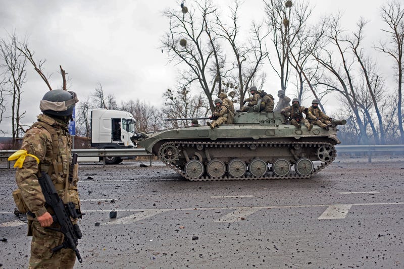 A Ukrainian APC drives on the road on March 3, 2022 in Sytniaky, Ukraine, west of the capital