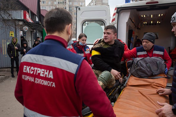 A Ukrainian serviceman, who was wounded in his shoulder during shelling in Irpin gets transferred to the hospital on March 6, 2022 in Kyiv, Ukraine.