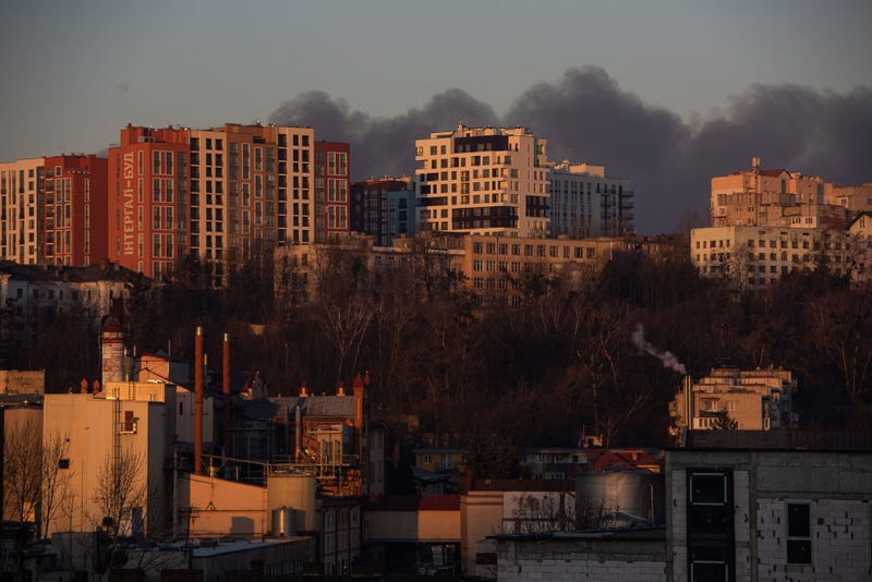LVIV, UKRAINE - MARCH 18: Smoke is seen above apartment blocks on March 18, 2022 in Lviv, Ukraine. Lviv's mayor said on Telegram that the airport was not hit, but an area nearby.