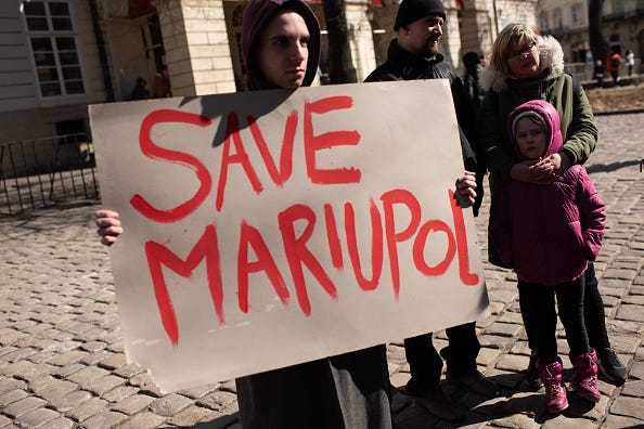 Ukrainians take part in an action in support of the residents and defenders of Mariupol on March 19, 2022 in Lviv, Ukraine. Lviv has served as a stopover and shelter for the millions of Ukrainians fleeing the Russian invasion, either to the safety of nearby countries or the relative security of western Ukraine. 