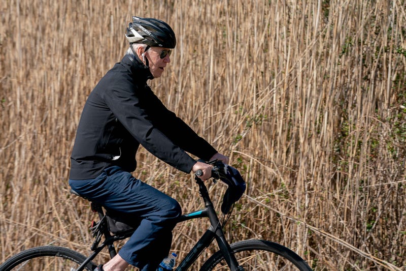 President Joe Biden rides his bike through Cape Henlopen State Park in Rehoboth Beach, Delaware, on March 20, 2022. 