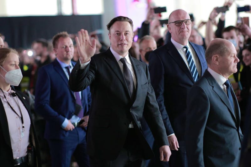 Elon Musk (center) attends the official opening of the new Tesla electric car manufacturing plant on March 22, 2022, near Gruenheide, Germany.