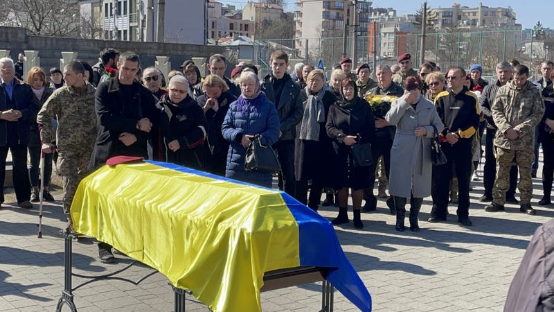 Ukrainian soldiers and civilians attend a funeral ceremony of Ukrainian soldier Igor Fedorchuk, who lost his life during Russian attacks on Nova Kakhovka, located near Russia's Kherson, in Lviv, Ukraine on March 24, 2022.