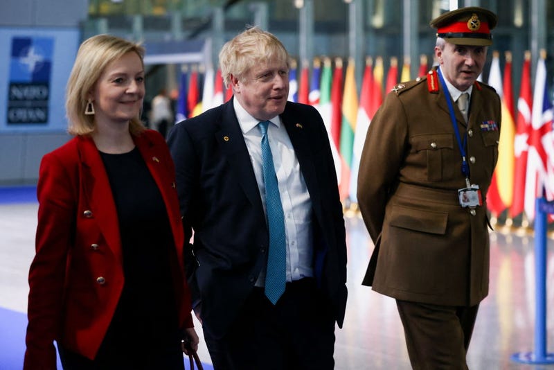 Former British Prime Minister Boris Johnson and former Foreign Secretary Liz Truss, who succeeded him as prime minister, as well as military representative to NATO Ben Bathurst leave NATO Headquarters following a NATO summit on Russia's invasion of Ukraine, at the alliance's headquarters in Brussels, on March 24, 2022 in Brussels, Belgium. 
