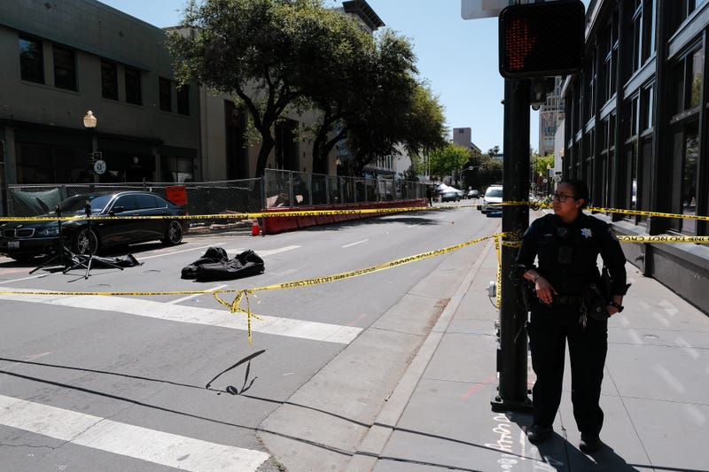 FILE - Police work the scene on the corner of 10th and J street after a shooting that occurred in the early morning hours on April 3, 2022 in Sacramento, California. Six people were killed and at least 10 were injured in the mass shooting in downtown Sacramento with no suspects in custody.