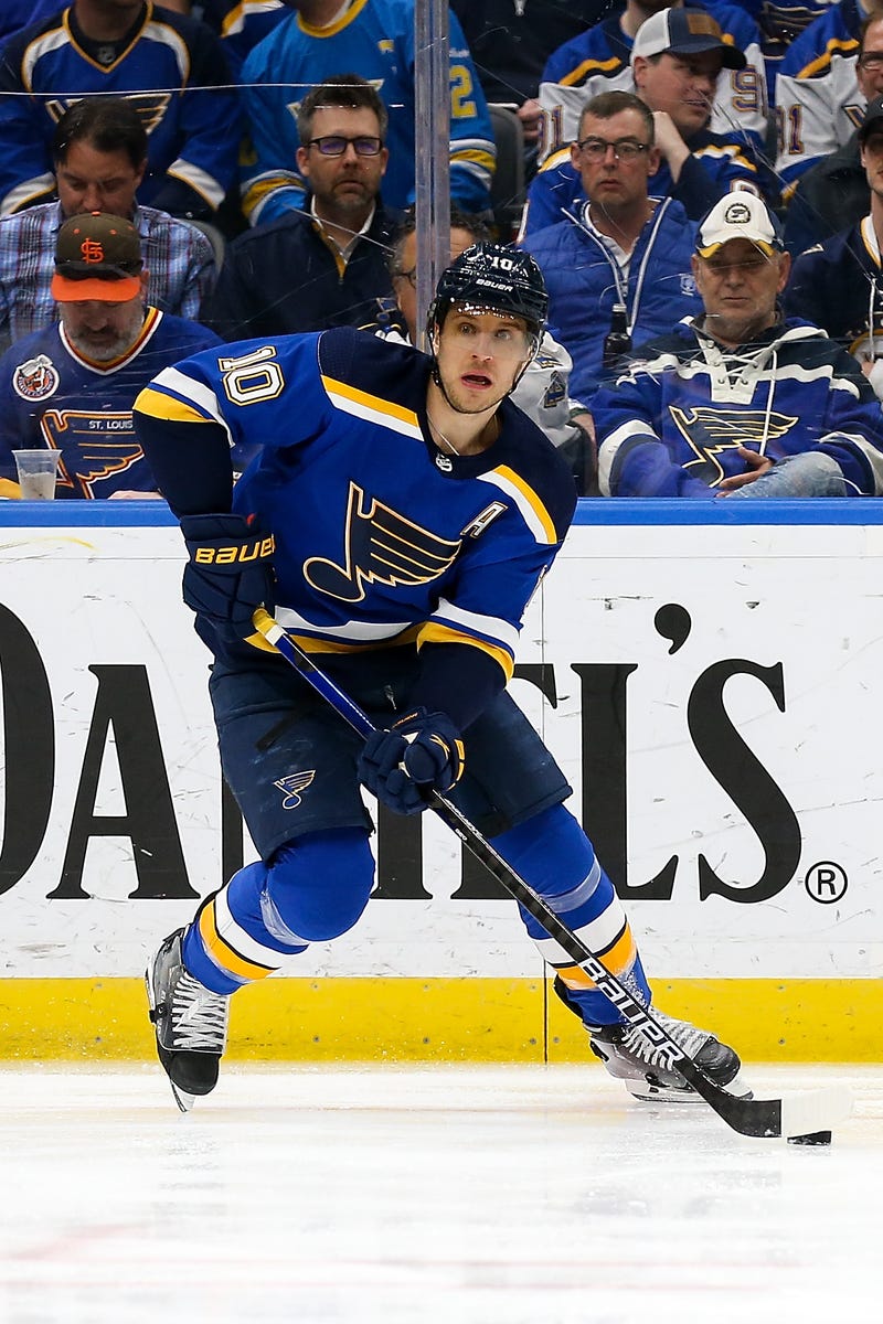 ST LOUIS, MO - APRIL 04: Brayden Schenn #10 of the St. Louis Blues controls the puck during the first period against the Arizona Coyotes at Enterprise Center on April 4, 2022 in St Louis, Missouri. (Photo by Scott Kane/Getty Images)