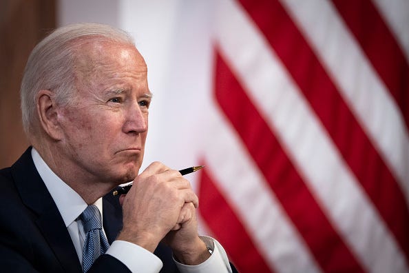 U.S. President Joe Biden listens as Prime Minister of India Narendra Modi (on screen not pictured) speaks during a virtual meeting in the South Court Auditorium of the White House complex April 11, 2022 in Washington, DC. 
