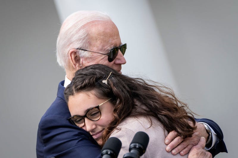 U.S. President Joe Biden hugs Mia Tretta, a Saugus High School shooting survivor, after she spoke during an event about gun violence in the Rose Garden of the White House April 11, 2022 in Washington, DC. Biden announced a new firearm regulation aimed at reining in ghost guns, untraceable, unregulated weapons made from kids. Biden also announced Steve Dettelbach as his nominee to lead the Bureau of Alcohol, Tobacco, Firearms and Explosives (ATF).