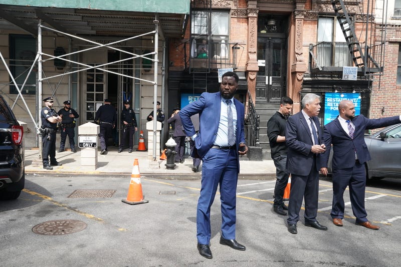 Police officers stand outside the 9th Precinct, where the suspect for yesterday's shooting at the 36th Street subway station is currently being held in police custody on April 13, 2022 in New York City