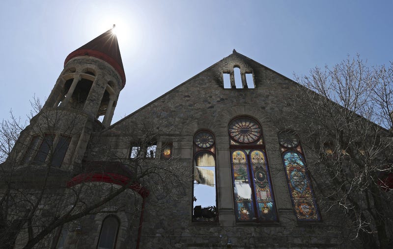 Damaged stained glass windows are illuminated by the sun at Antioch Missionary Baptist Church on Saturday, April 16, 2022, in Chicago. Work to rebuild the church began on Tuesday, Nov. 26, 2024.
