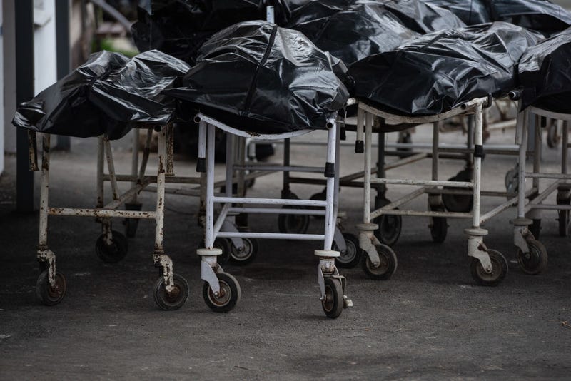 Body bags are seen by the morgue building on April 18, 2022 in Bucha, Ukraine. The Kyiv suburb was heavily damaged in fighting between invading Russian forces and Ukrainian troops weeks before.