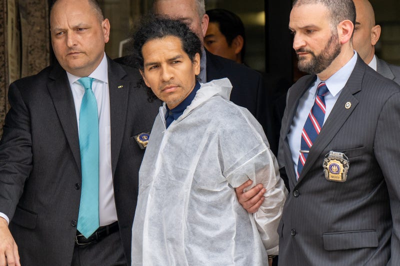 David Bonola, 44, a suspect in the gruesome stabbing of Orsolya Gaal, 51, is taken from the NYPD's 112th Precinct stationhouse in Queens on April 21, 2022