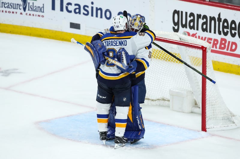 ST PAUL, MN - MAY 10: Vladimir Tarasenko #91, who scored his three goals in the third period for a hat trick, and goaltender Jordan Binnington #50 of the St. Louis Blues celebrate a 5-2 victory against the Minnesota Wild in Game Five of the First Round of the 2022 Stanley Cup Playoffs at Xcel Energy Center on May 10, 2022 in St Paul, Minnesota. The Blues took a 3-2 series lead against the Wild. (Photo by David Berding/Getty Images)