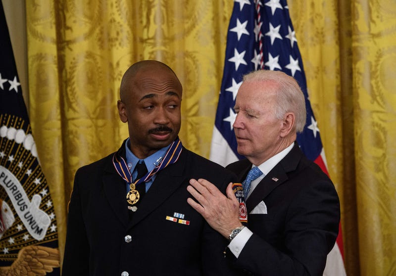 US President Joe Biden presents the Medal of Valor to Abraham Miller, of the New York City Fire Department, at the White House in Washington, DC, on May 16, 2022.
