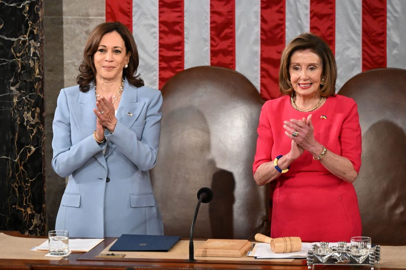 Then-U.S. House Speaker Nancy Pelosi (D-CA) (R) and Vice President Kamala Harris applaud prior to the address of Greek Prime Minister Kyriakos Mitsotakis during a joint session of Congress in Washington, DC, on May 17, 2022