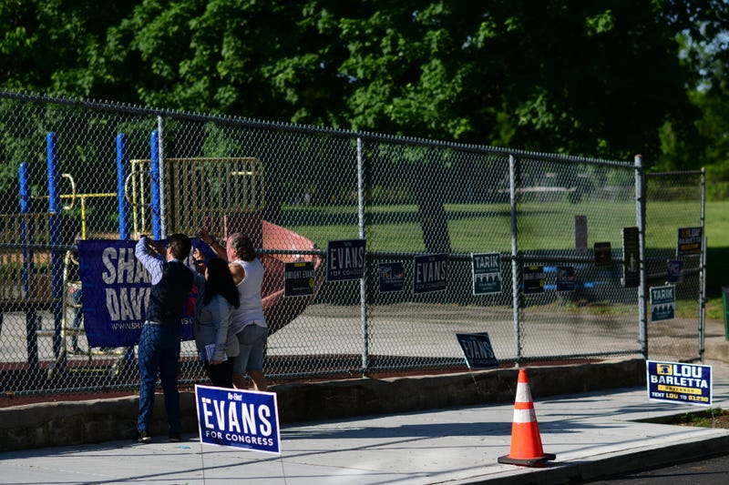 Supporters hang a placard for Democrat candidate for governor Josh Shapiro at the Hillside Recreation Center polling location during the Pennsylvania Primary election on May 17, 2022, in Philadelphia, Pennsylvania. 